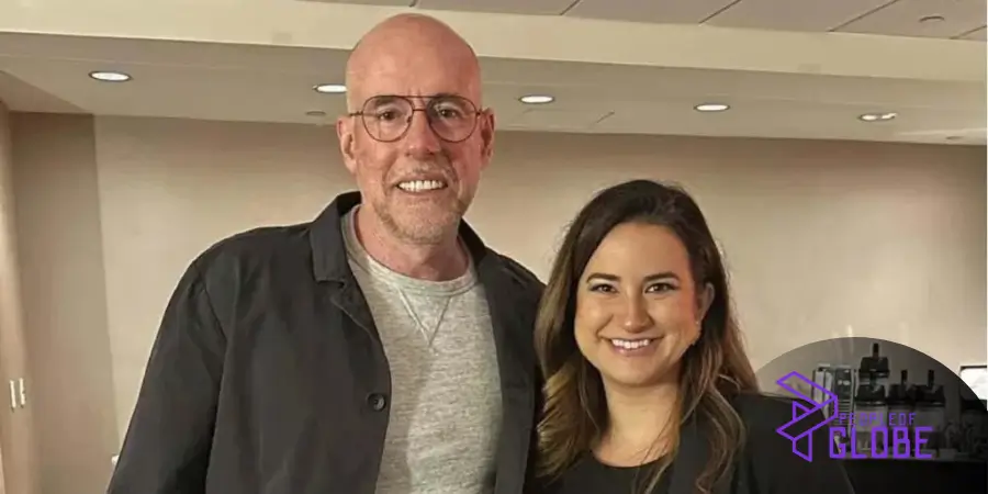 A high-quality professional indoor portrait of Beata Galloway smiling alongside a colleague.