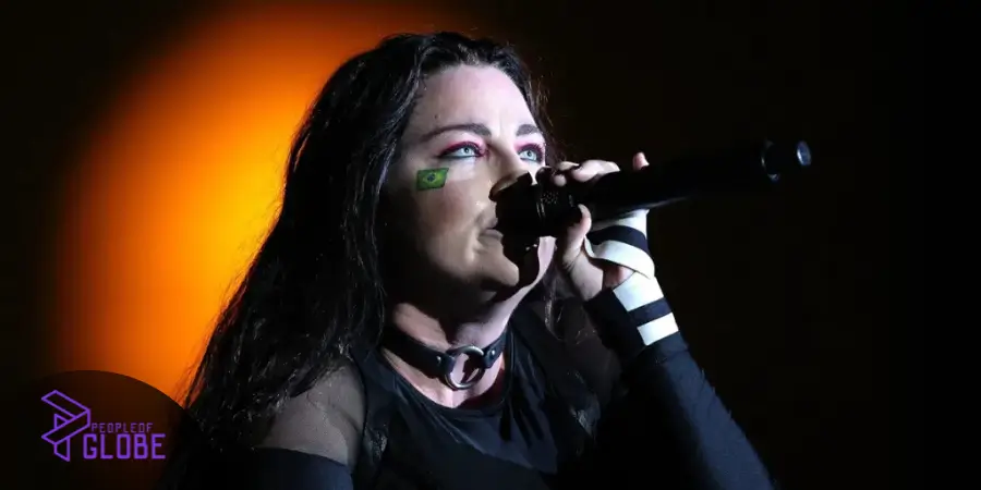 Amy Lee smiling warmly, representing her life off-stage as a mother and dedicated family member.